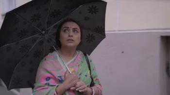 Mrs. Chatterjee vs. Norway: An Indian mother walks with umbrella wearing pink and green sari