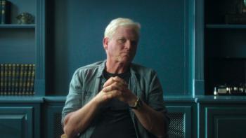 Murder in Monaco film: Ted Maher clasps his hands together as he sits in an interview chair