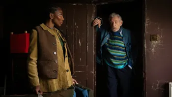 The Christophers: Ian McKellen stands in a doorway speaking to Michaela Coel