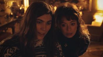 My Dearest Señorita: Two women look at a painting.