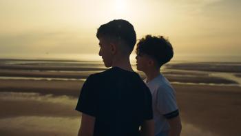 Name Me Lawand: Two young brothers stand on a beach together, looking out to sea