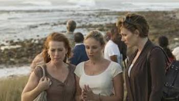 Natalee Holloway movie: Three women stand by the shore, looking concerned.