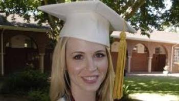 Natalee Holloway movie: Smiling graduate with cap and tassel, outdoors in sunny setting.