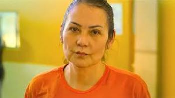 Nelma Kodama: Woman in orange prison suit
