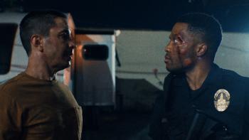 Night Patrol Movie: Ethan (Justin Long) confronts a bloodied and bruised Xavier (Jermaine Fowler) on the streets at night