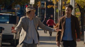 Nirvanna the Band the Show the Movie: Matt and Jay walk down the street, smiling; Matt gestures with his arms