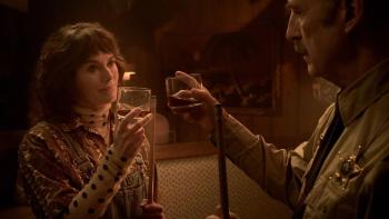 Normal Movie: Holding pool cues, Ulysses and bartender Moira (Lena Headey) clink glasses in the local eatery