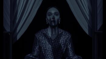 Nosferatu Movie: Ellen (Lily-Rose Depp) has a shocked expression as the shadow of a clawed hand crawls up her face