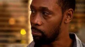 Not an Artist movie: Bobby "The RZA" Diggs center looks to the side quizzically