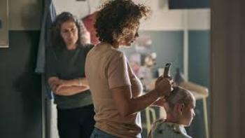 Nothing to Lose movie: Woman shaving another's head in a dimly lit room; an onlooker watches intently.