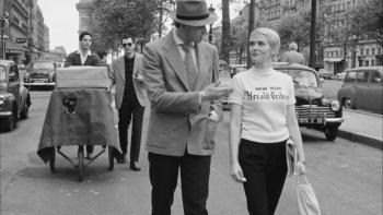 Nouvelle Vague Movie: Belmondo and Seberg walk down the street in character while Godard films with a mobile contraption