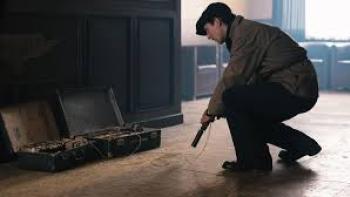 Number 24 movie: Man with gun crouches down