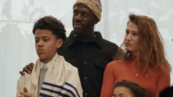 Occupied City Movie: An interracial Jewish family of four stands together
