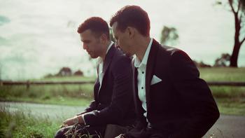 Of an Age Movie: Thom Green and Elias Anton sit together outside 