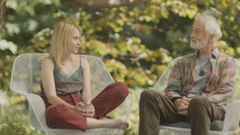 O Horizon Movie: Sitting in deck chairs, Abby (Maria Bakalova) has an emotional visit with her AI dad (David Strathairn)