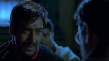 Omkara: a close-up of Omkara talking to someone