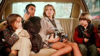 One Fine Day: George Clooney and Michelle Pfeiffer are in the back of a car with their children