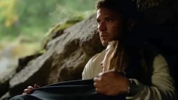 One Mile: Chapter One movie: Ryan Phillippe holds a sleeping Amelie Hoeferle in a cave