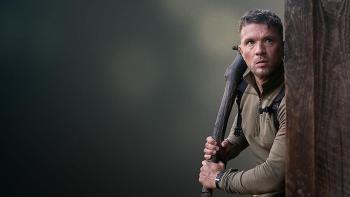 One Mile: Chapter Two movie: Ryan Phillippe stands holding a pipe around the corner of a building