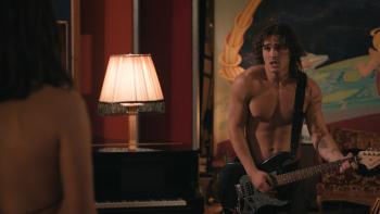 One Night Only movie: A shirtless Ezra Strong (Charlie Gillespie) serenades Allie (Monica Barbaro) during the annual 12 hours of sexual freedom