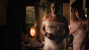One Night Only movie: Rick (Levar Burton) and Linda (Molly Ringwald)) look surprised to be interrupted while covered in bubble wrap
