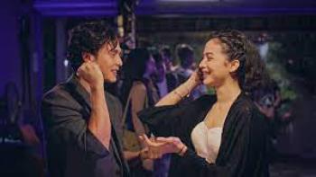 One Night Stand: In club, Indonesian man left holds opposite hand of Indonesian woman right while they both smile at each other