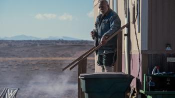 Onslaught Movie: Celeste's neighbor Josiah (Reginald VelJohnson) stands at the top of his steps, looking concerned