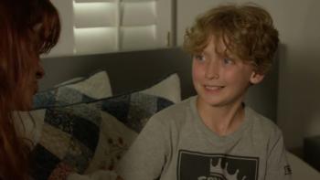 Operation Friendship: a young boy smiles at a character offscreen 