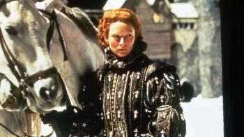 Orlando: Tilda Swinton stands in elaborate Elizabethan clothing next to a white horse