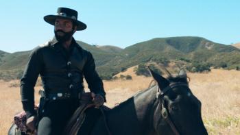 Outlaw Johnny Black Movie: Michael Jai White, sitting on a horse, looks at the vast landscape