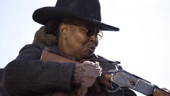 Outlaw Posse Movie: A furious-looking Stagecoach Mary (Whoopi Goldberg) aims a rifle at something