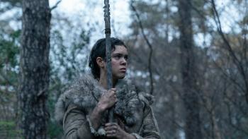 Out of Darkness Movie: Beyah (Safia Oakley-Green) stands in the woods, at the ready, holding her spear and draped in furs