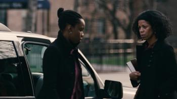 Pariah Movie Poster: Two women in conversation next to a car on a city street.