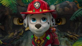 Paw Patrol: The Dino Movie: Marshall poses in front of a dinosaur