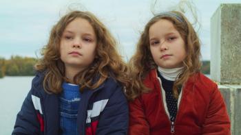 Petite Maman: Joséphine Sanz and Gabrielle Sanz looking at camera