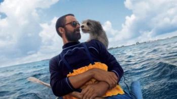 Pets: Man and dog on kayak