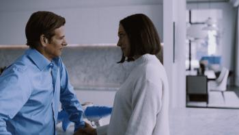 PH-1 movie: Senator Payton Burnham (Mark Kassen) speaks with his wife in their kitchen