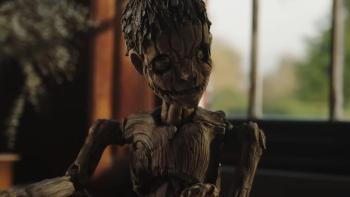 Pinocchio Unstrung Movie: The wooden Pinocchio puppet looks like he's listening to someone speak