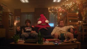 Pizza Movie: Gaten Matarazzo and Sean Giambrone on a couch with a hallucinated character.