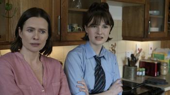 Power Ballad movie: Rick Power's wife (Marcella Plunkett) and daughter (Beth Fallon) are uncertain, leaning against the kitchen counter