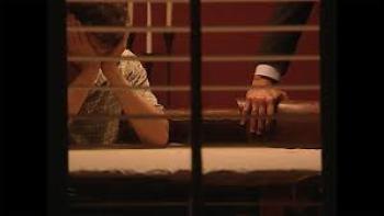 Predators Movie: View through window of a man caught