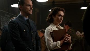 Pressure movie: British Armed Forces meteorologist James Stagg (Andrew Scott) stands next to Lt. Kay Summersby (Kerry Condon) in a 1940s war room