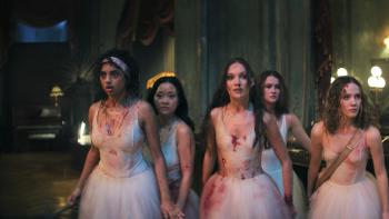 Pretty Lethal: Avantika, Lana Condor, Maddie Ziegler, Millicent Simmonds, and Iris Apatow walk through a building in bloodied white tutus