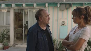 Prisoner's Daughter Movie: Standing in a back yard, Brian Cox talks to Kate Beckinsale