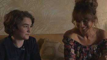 Prisoner's Daughter Movie: A 12-year-old White boy and his mom sit on his bed, talking
