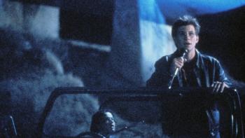 Pump Up the Volume: Christian Slater speaks into a microphone as he stands in an open-top car driven by Samantha Mathis