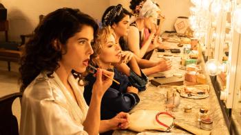 Queen of the Ring movie: Emily Bett Rickards puts makeup on at a vanity counter