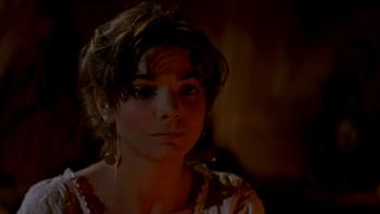 Quigley Down Under: Laura San Giacomo sits by fire