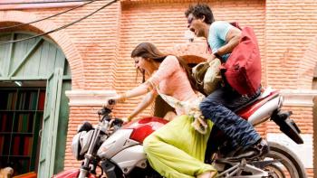 Rab Ne Bana Di Jodi: An Indian woman driving a motorbike rashly with an Indian man sitting behind her scared