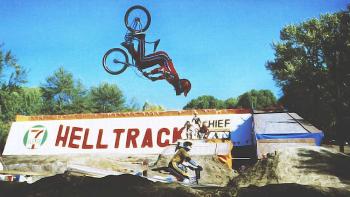 Rad movie: Bill Allen does a flip on his BMX bike with another racer looking below him